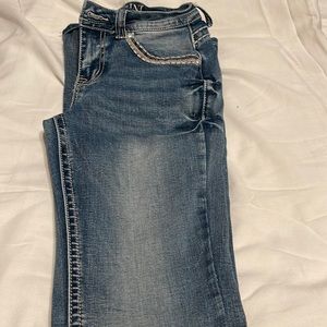 bootcut jeans , light wash , back pockets with rhinestone